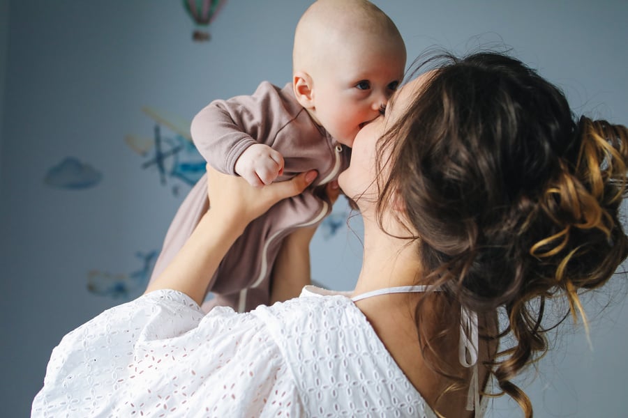 Mother Kissing Her Cute Baby