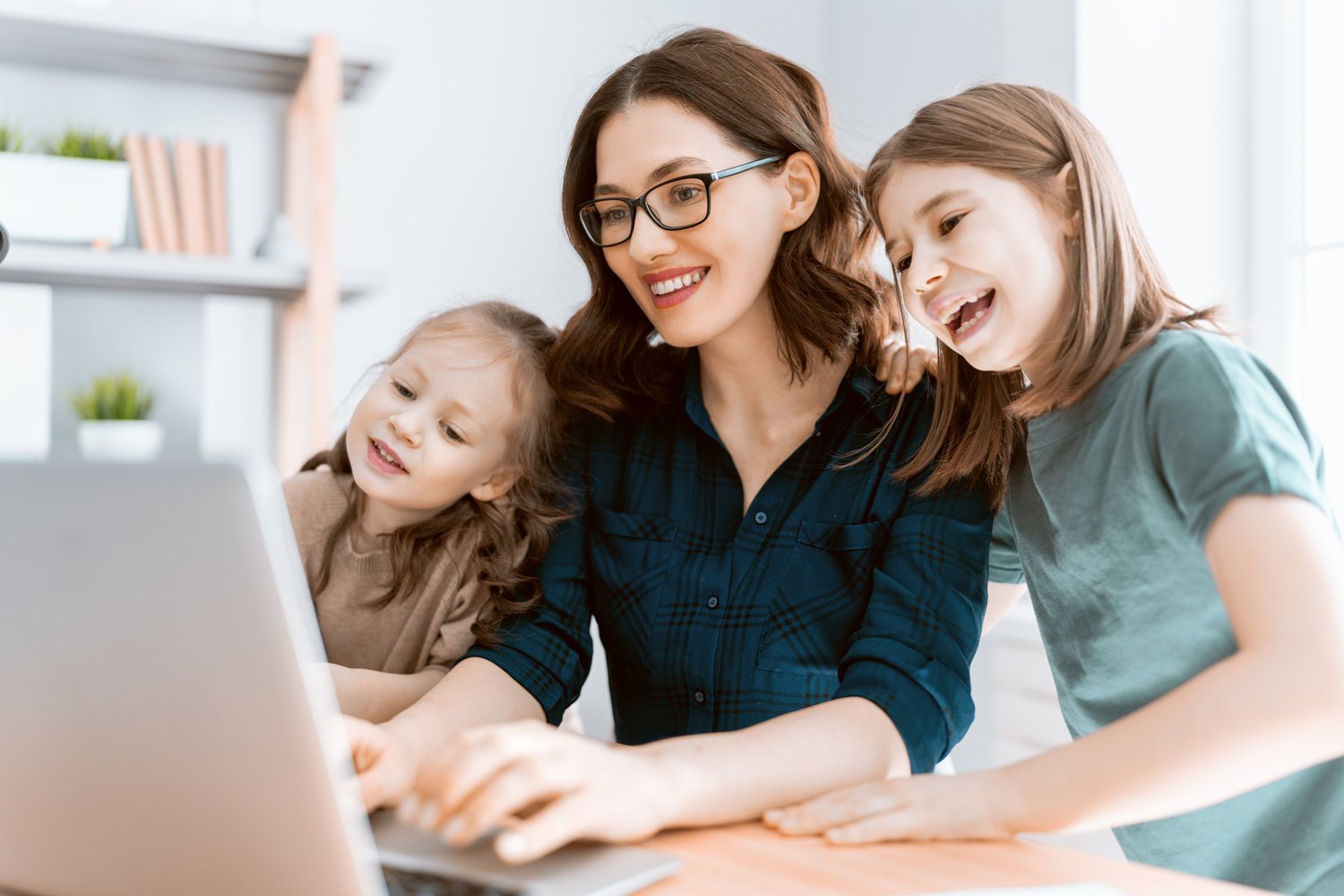 Mother with Children Working on the Computer